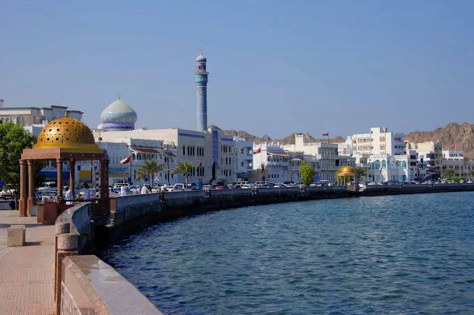 Muscat city view with a golden dome and traditional pavilion